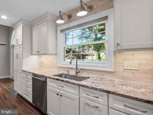 410 Metropolitan Blvd, Pasadena, MD 21122 - kitchen featuring stainless steel dishwasher, a sink, white cabinetry, light stone counters, and backsplash