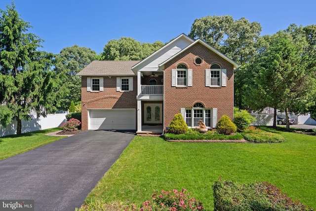 410 Metropolitan Blvd, Pasadena, MD 21122 - view of front of property featuring a balcony, an attached garage, asphalt driveway, brick siding, and french doors