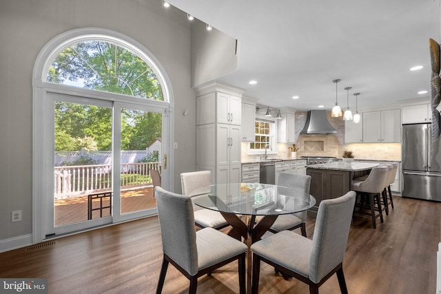 410 Metropolitan Blvd, Pasadena, MD 21122 - dining area with healthy amount of natural light, dark wood-style floors, recessed lighting, and baseboards