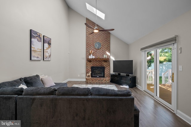 410 Metropolitan Blvd, Pasadena, MD 21122 - living area featuring a skylight, high vaulted ceiling, wood finished floors, a brick fireplace, and baseboards