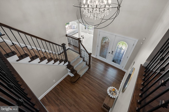 410 Metropolitan Blvd, Pasadena, MD 21122 - foyer entrance featuring a towering ceiling, stairway, wood finished floors, a chandelier, and plenty of natural light