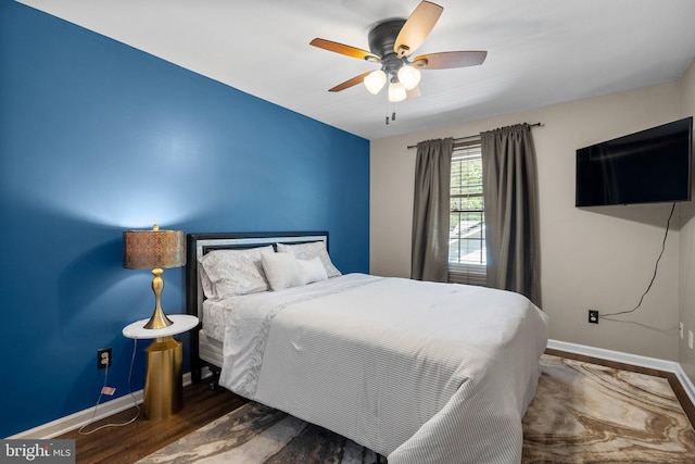 410 Metropolitan Blvd, Pasadena, MD 21122 - bedroom featuring baseboards, ceiling fan, and wood finished floors