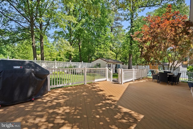 410 Metropolitan Blvd, Pasadena, MD 21122 - wooden deck featuring a grill, a fenced backyard, and outdoor dining space