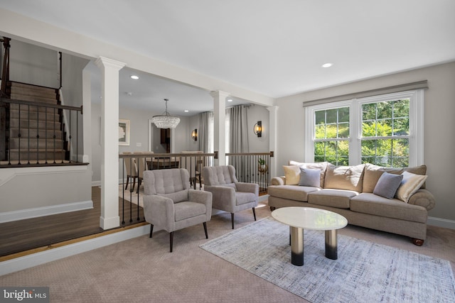 410 Metropolitan Blvd, Pasadena, MD 21122 - carpeted living room featuring ornate columns, stairway, recessed lighting, baseboards, and a chandelier