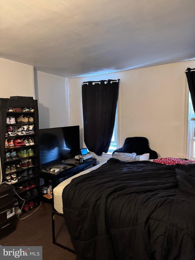 bedroom featuring carpet