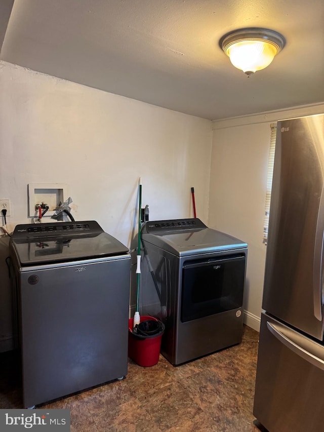 laundry room featuring washer and clothes dryer