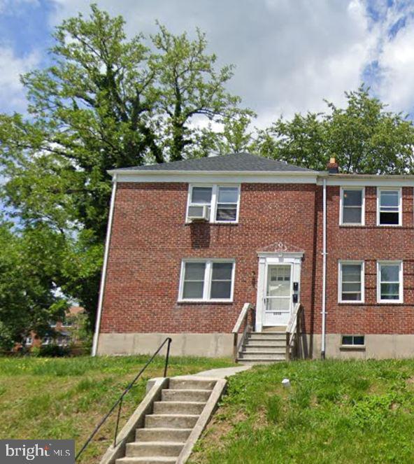 view of property with brick siding