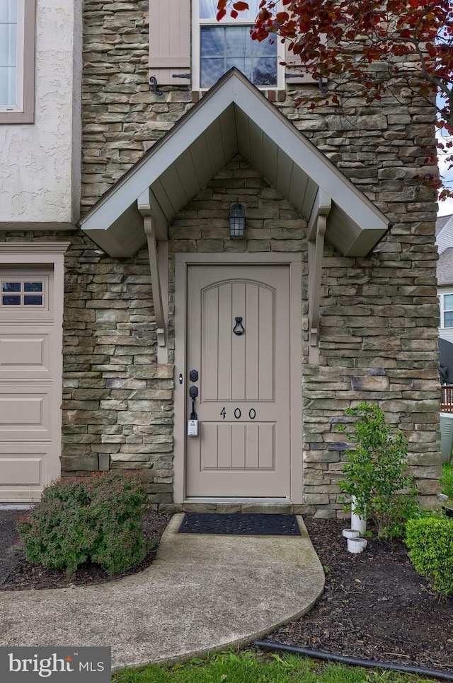 view of exterior entry with stone siding