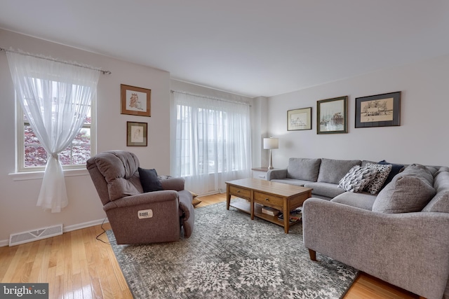 living room with wood finished floors and baseboards