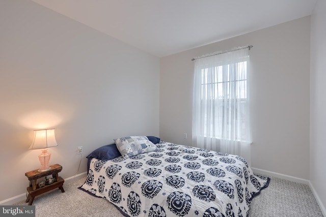 carpeted bedroom with baseboards