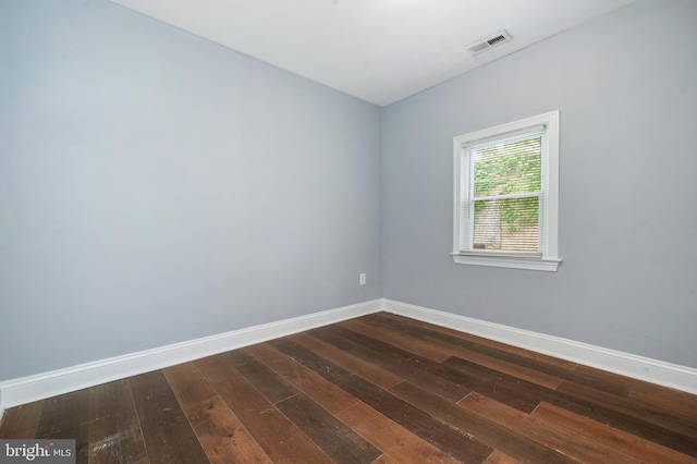 3322 Ely Pl SE, Washington, DC 20019 - unfurnished room featuring dark wood-style floors and baseboards