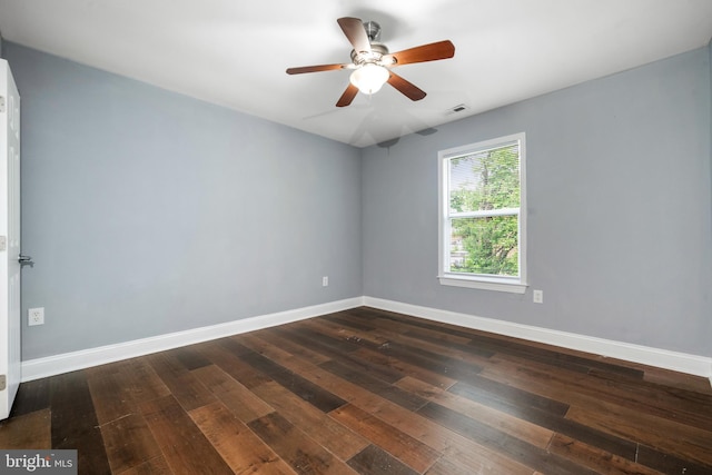 3322 Ely Pl SE, Washington, DC 20019 - empty room with dark wood-type flooring, baseboards, and ceiling fan