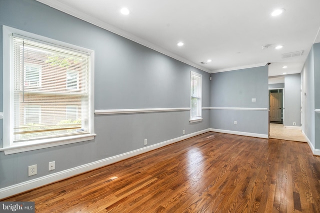 3322 Ely Pl SE, Washington, DC 20019 - spare room featuring crown molding, wood finished floors, baseboards, and recessed lighting