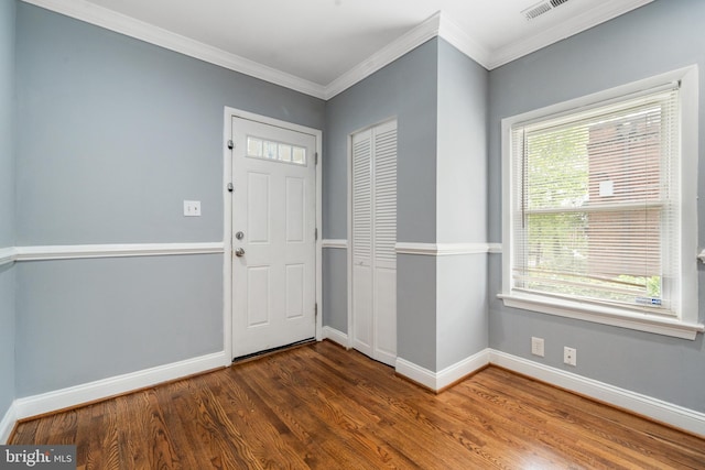 3322 Ely Pl SE, Washington, DC 20019 - foyer with baseboards, wood finished floors, and ornamental molding