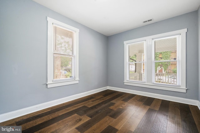 3322 Ely Pl SE, Washington, DC 20019 - unfurnished room with baseboards and dark wood-type flooring