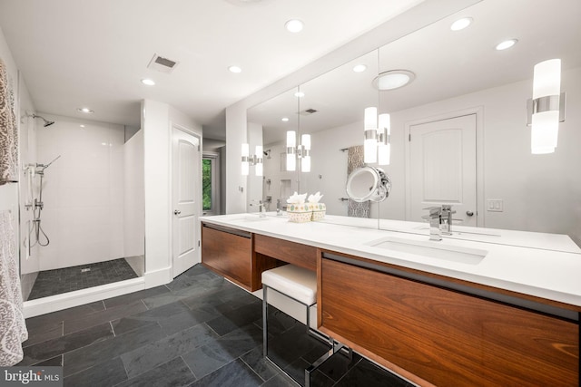 full bath with tiled shower, double vanity, and recessed lighting