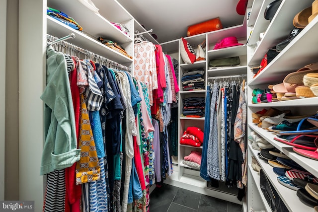 spacious closet featuring tile patterned flooring