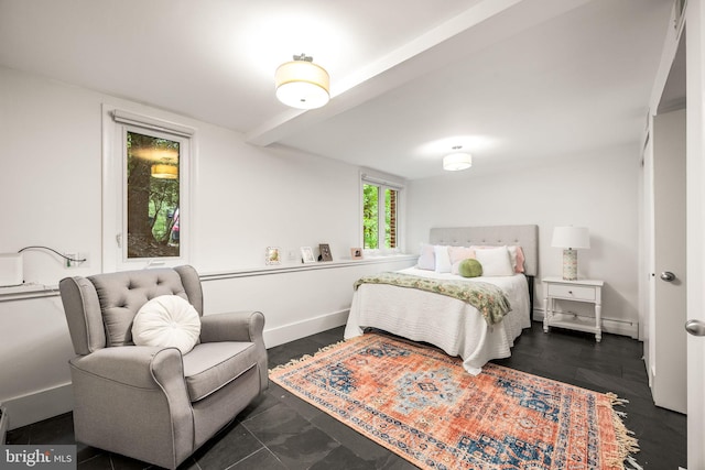 bedroom featuring baseboards