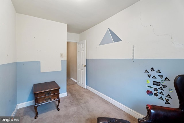 sitting room with carpet floors and baseboards
