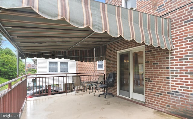 view of patio / terrace with a balcony
