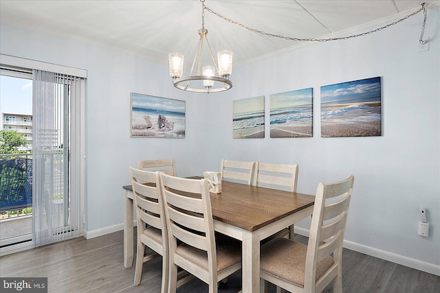 6007 Atlantic Ave Unit 207, Ocean City, MD 21842 - dining space with a chandelier, plenty of natural light, wood finished floors, baseboards, and ornamental molding