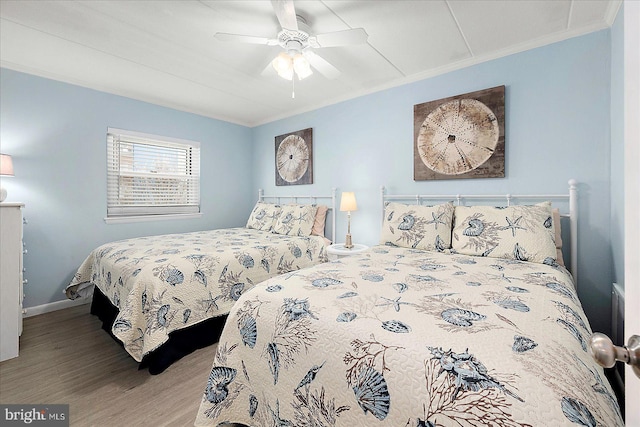 6007 Atlantic Ave Unit 207, Ocean City, MD 21842 - bedroom featuring ornamental molding, wood finished floors, baseboards, and ceiling fan