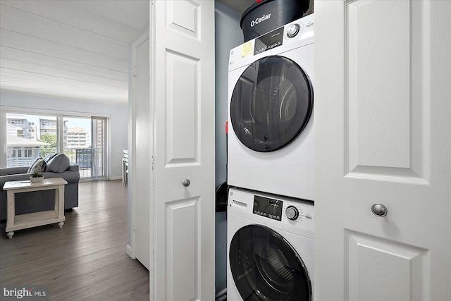6007 Atlantic Ave Unit 207, Ocean City, MD 21842 - laundry room with stacked washer / drying machine, wood finished floors, and baseboards