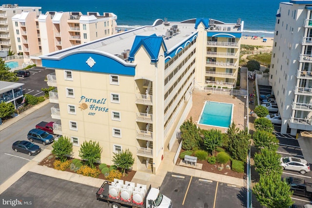 6007 Atlantic Ave Unit 207, Ocean City, MD 21842 - view of building exterior featuring uncovered parking and a water view