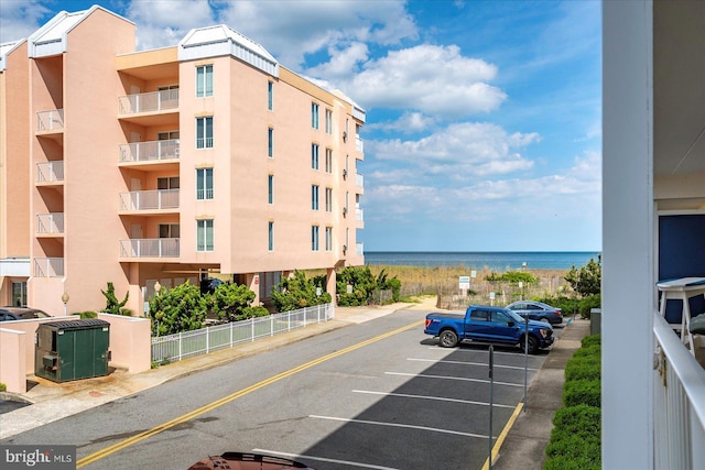6007 Atlantic Ave Unit 207, Ocean City, MD 21842 - view of apartment building / complex with uncovered parking and a water view