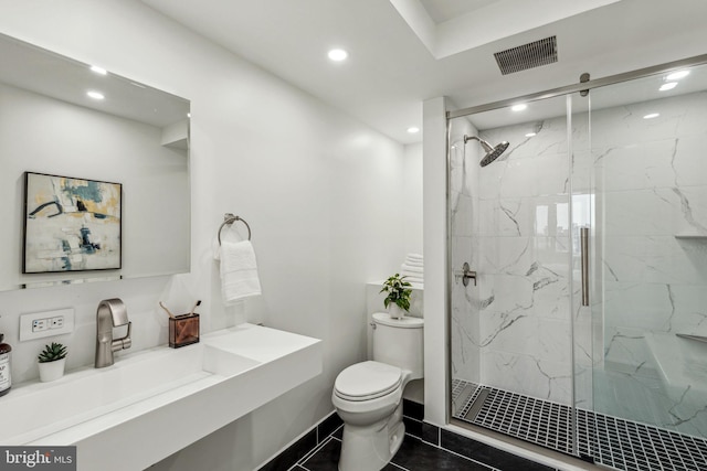 604 S Washington Sq Unit 2917, Philadelphia, PA 19106 - bathroom with toilet, recessed lighting, a marble finish shower, vanity, and tile patterned flooring
