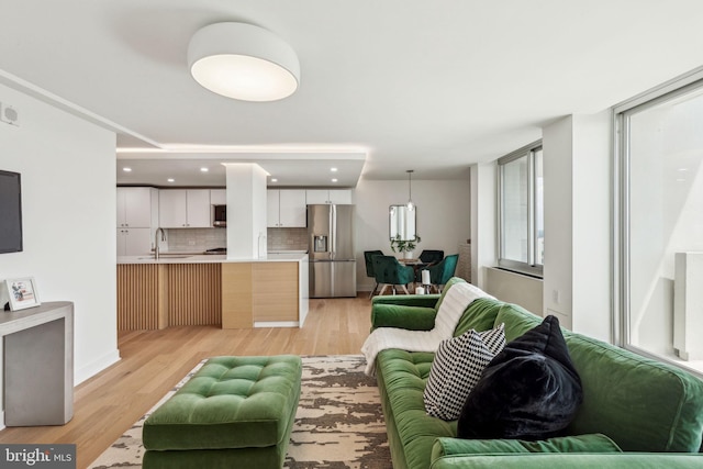 604 S Washington Sq Unit 2917, Philadelphia, PA 19106 - living room featuring light wood finished floors and recessed lighting