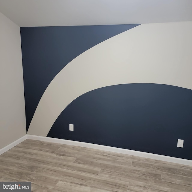 3608 Upshur St, Brentwood, MD 20722 - empty room featuring wood finished floors, baseboards, and vaulted ceiling