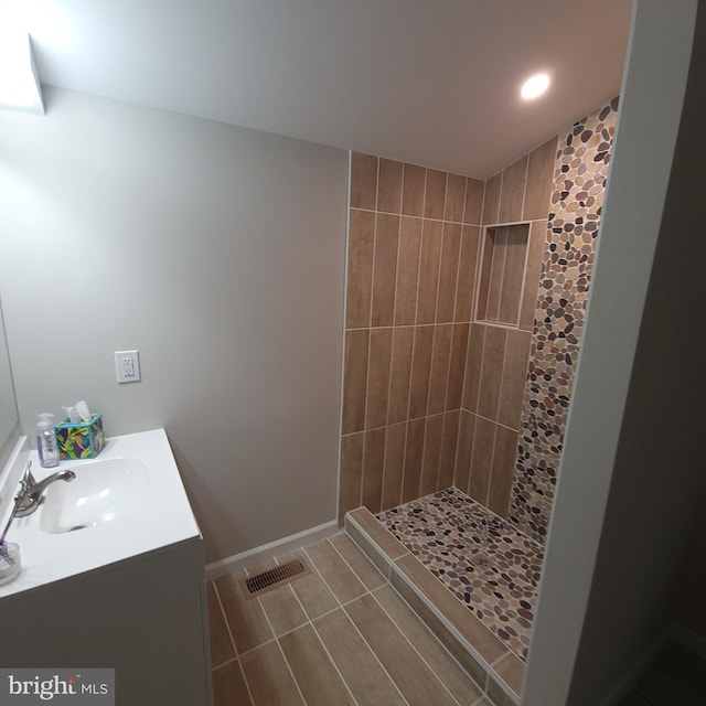 3608 Upshur St, Brentwood, MD 20722 - bathroom featuring vanity, tiled shower, tile patterned floors, baseboards, and recessed lighting