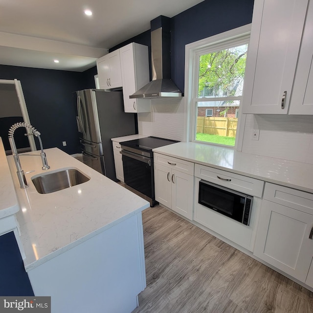 3608 Upshur St, Brentwood, MD 20722 - kitchen featuring wall chimney range hood, electric range, black microwave, a sink, and white cabinetry