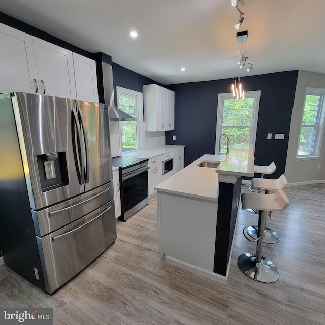 3608 Upshur St, Brentwood, MD 20722 - kitchen with stainless steel fridge with ice dispenser, range, a sink, healthy amount of natural light, and recessed lighting
