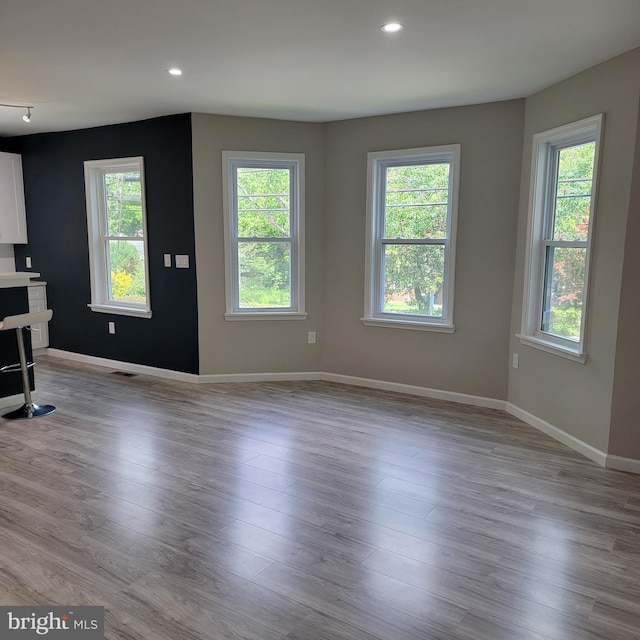 3608 Upshur St, Brentwood, MD 20722 - unfurnished living room with healthy amount of natural light, baseboards, wood finished floors, and recessed lighting