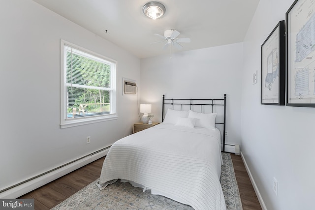 15415 Michigan Rd, Woodbridge, VA 22191 - bedroom with a baseboard radiator, wood finished floors, and an AC wall unit