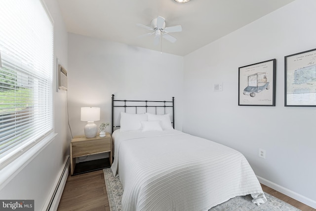 15415 Michigan Rd, Woodbridge, VA 22191 - bedroom with a baseboard heating unit, wood finished floors, baseboards, and ceiling fan