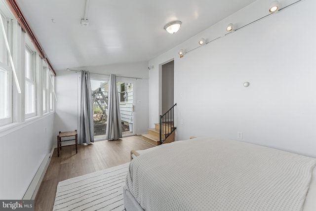 15415 Michigan Rd, Woodbridge, VA 22191 - bedroom with access to outside, wood finished floors, and vaulted ceiling