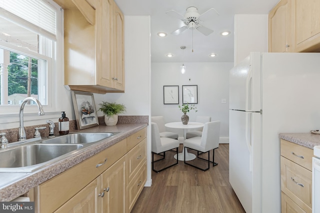 15415 Michigan Rd, Woodbridge, VA 22191 - kitchen with light brown cabinets, a sink, wood finished floors, freestanding refrigerator, and recessed lighting