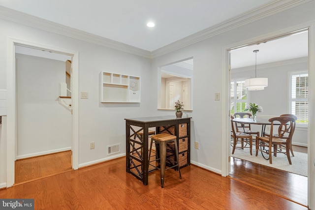 1153 Randolph Rd, Mclean, VA 22101 - dining space with wood finished floors, crown molding, and recessed lighting