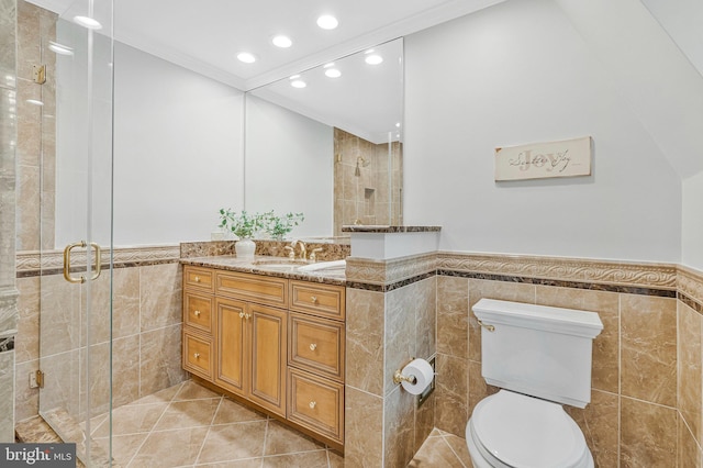 1153 Randolph Rd, Mclean, VA 22101 - bathroom featuring tile walls, wainscoting, vanity, a stall shower, and recessed lighting