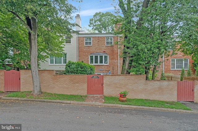 1153 Randolph Rd, Mclean, VA 22101 - view of front of house with a gate, a fenced front yard, and brick siding