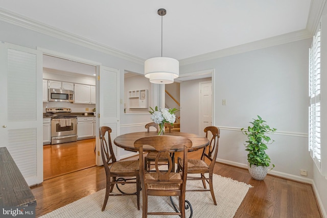 1153 Randolph Rd, Mclean, VA 22101 - dining area featuring ornamental molding, light wood-type flooring, and plenty of natural light