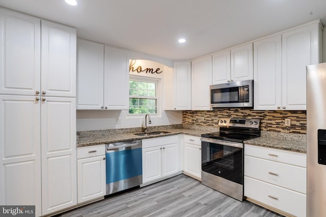 5 Wood Oak, Nottingham, MD 21236 - kitchen featuring stainless steel appliances, stone countertops, light wood-type flooring, white cabinets, and recessed lighting