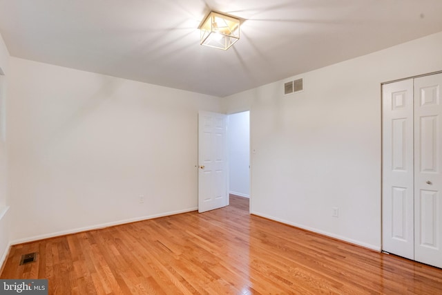 5 Wood Oak, Nottingham, MD 21236 - unfurnished bedroom with light wood finished floors and a closet