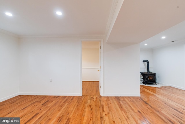 5 Wood Oak, Nottingham, MD 21236 - empty room featuring ornamental molding, a wood stove, light wood-style flooring, and recessed lighting