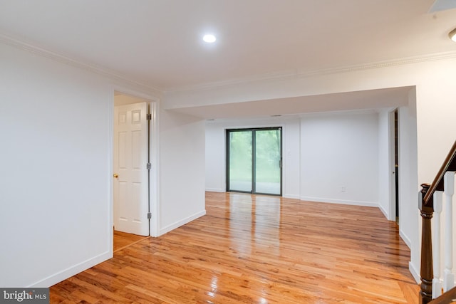 5 Wood Oak, Nottingham, MD 21236 - spare room with ornamental molding, light wood-style flooring, stairs, and recessed lighting
