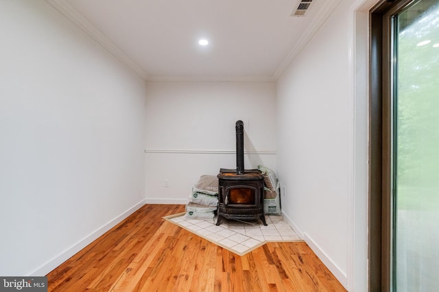 5 Wood Oak, Nottingham, MD 21236 - detailed view of a wood stove, ornamental molding, wood finished floors, and recessed lighting