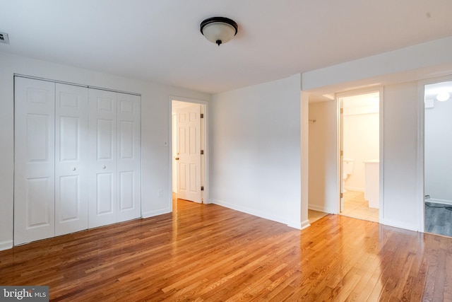 5 Wood Oak, Nottingham, MD 21236 - unfurnished bedroom featuring light wood-style flooring, a closet, and ensuite bath
